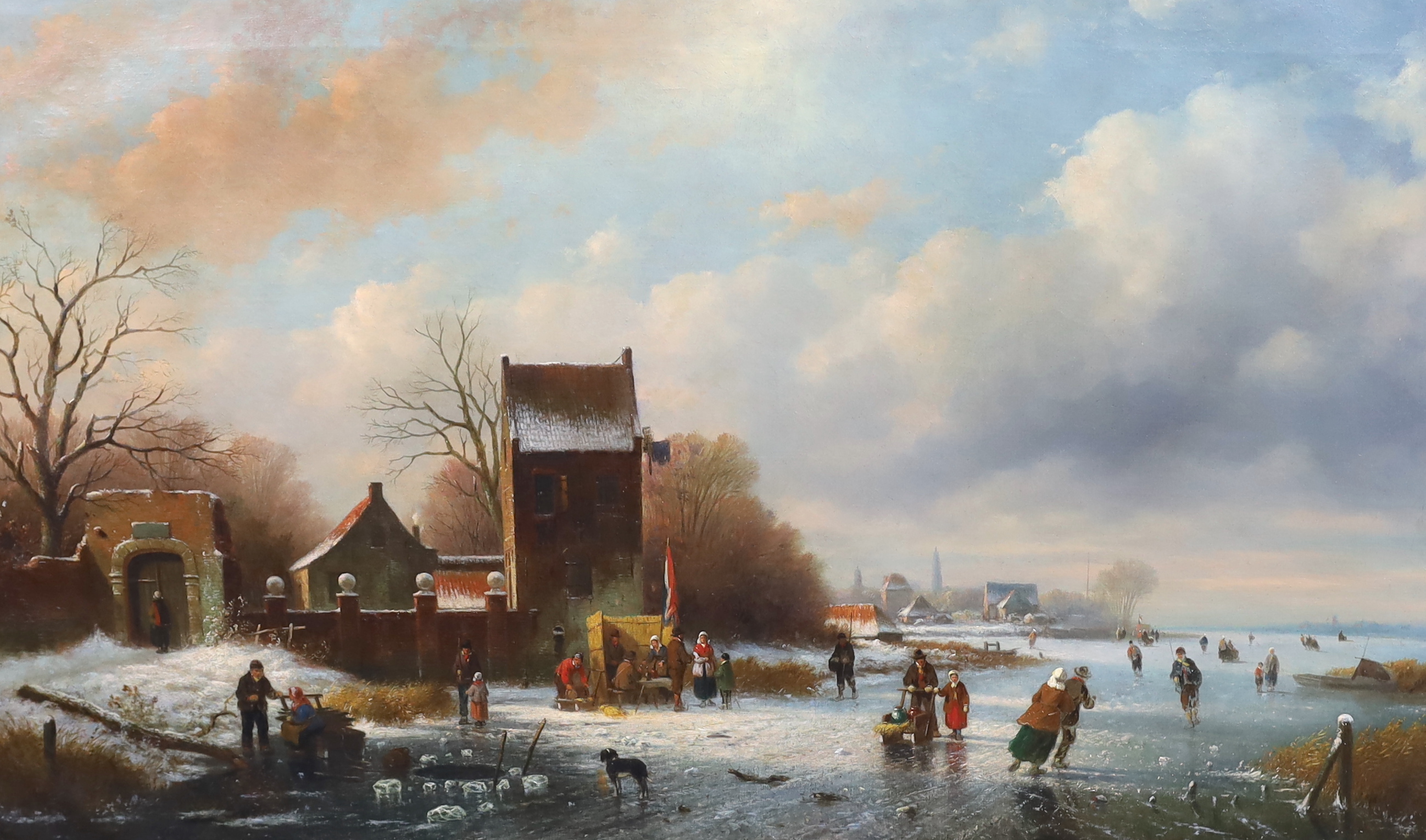 Circle of Frederik Marinus Kruseman (Dutch 1816-1882), Dutch winter landscape with figures skating on a frozen river, oil on canvas, 59 x 97cm, Please note this lot attracts an additional import tax of 5% on the hammer p